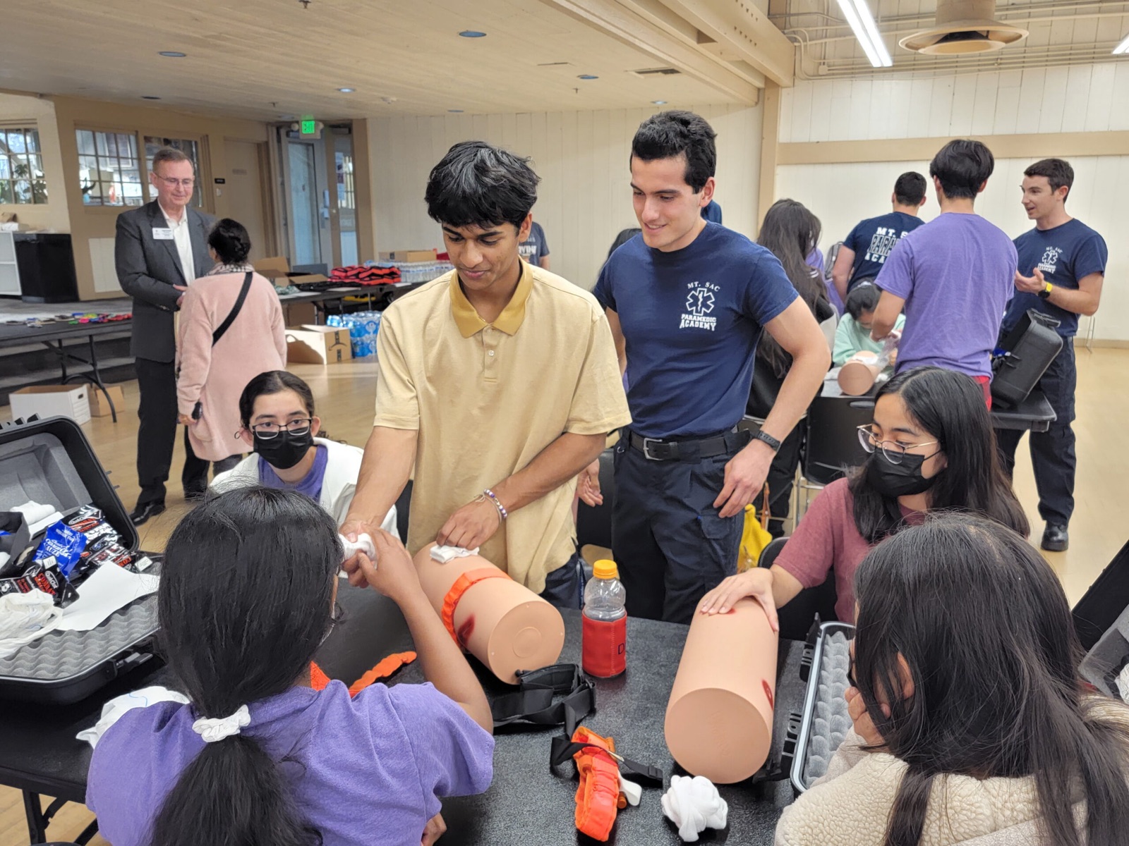 Students practicing bleeding control at a Stop the Bleed training